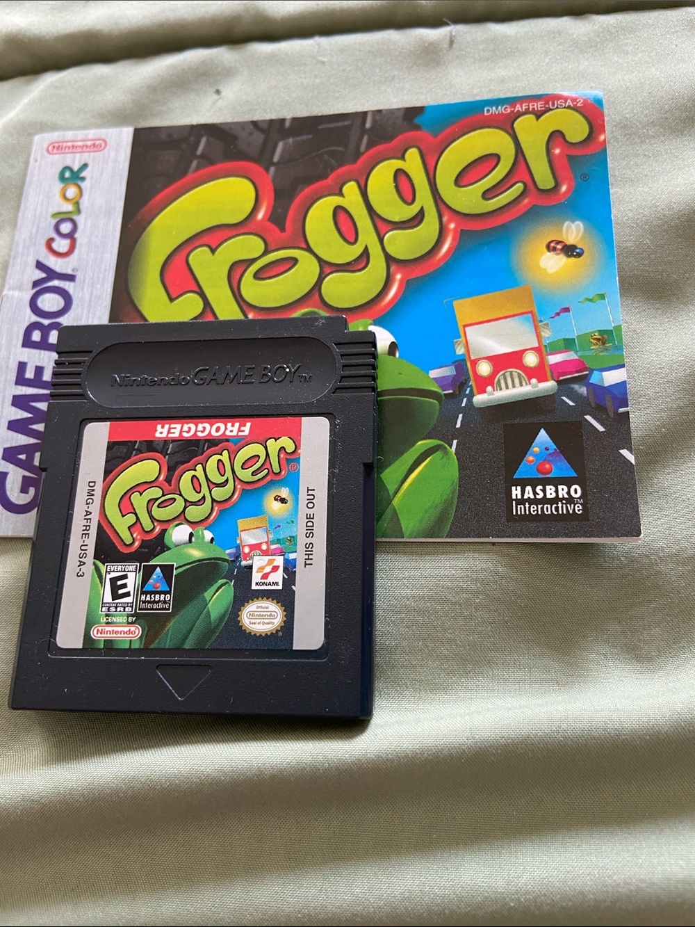 Frogger game cartridge and booklet